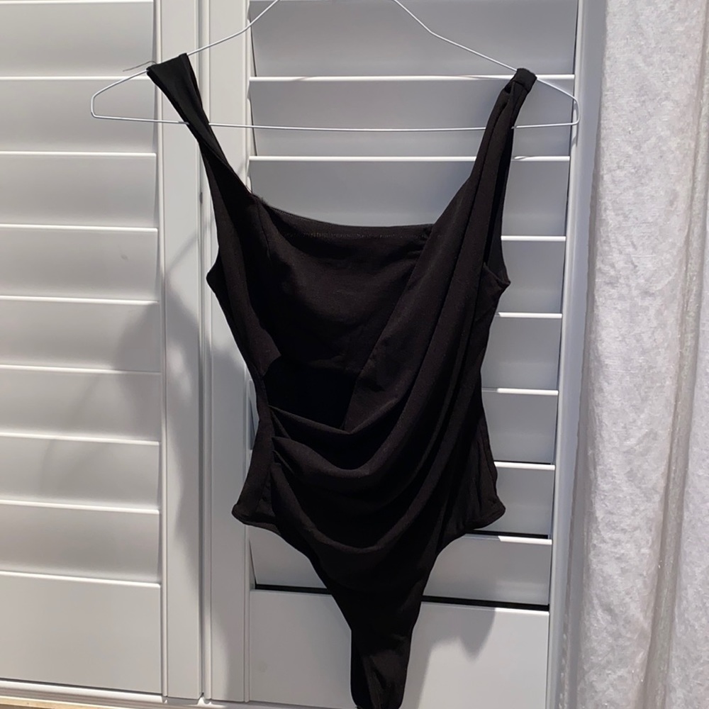 Black bodysuit with a whole in the front
